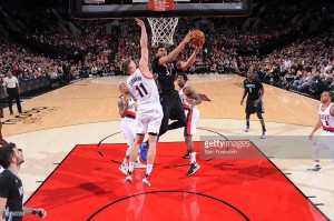 Karl-Anthony Towns #32 of the Minnesota Timberwolves goes to the basket against the Portland Trail Blazers on January 31, 2016 at the Moda Center in Portland, Oregon. ( Photo by Sam Forencich@gettyimages )