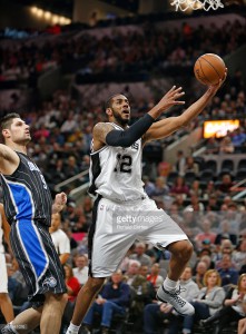 LaMarcus Aldridge #12 of the San Antonio Spurs drives on Nikola Vucevic #9 of the Orlando Magic at AT&T Center on February 1, 2016 in San Antonio, Texas. ( Photo by Ronald Cortes@gettyimages )