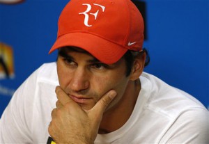 Roger Federer of Switzerland answers questions at a press conference following his semifinal loss to to Novak Djokovic of Serbia at the Australian Open tennis championships in Melbourne, Australia, Thursday, Jan. 28, 2016.(AP Photo/Vincent Thian) 