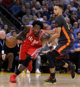 Houston Rockets' Patrick Beverley, left, drives the ball against Golden State Warriors' Stephen Curry during the first half of an NBA basketball game Tuesday, Feb. 9, 2016, in Oakland, Calif. ( Photo: Ben Margot, AP )