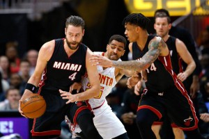 Miami Heat forward Josh McRoberts (4) tries to keep the ball from Atlanta Hawks forward Thabo Sefolosha (25) during the first half Friday, Feb. 19, 2016, in Atlanta. Todd Kirkland AP