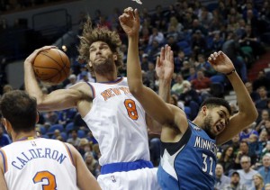 New York Knicks' Robin Lopez, left, beats Minnesota Timberwolves' Karl-Anthony Towns to the rebound during the first quarter of an NBA basketball game Saturday, Feb. 20, 2016, in Minneapolis. (Credit: AP/ Jim Mone)