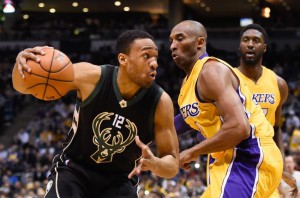 Feb 22, 2016; Milwaukee, WI, USA; Milwaukee Bucks forward Giannis Antetokounmpo (34) drives for the basket against Los Angeles Lakers forward Kobe Bryant (24) in the first quarter at BMO Harris Bradley Center. Mandatory Credit: Benny Sieu USA TODAY SPORTS