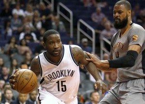 Brooklyn Nets guard Donald Sloan (15) drives past Phoenix Suns center Tyson Chandler in the first quarter during an NBA basketball game, Thursday, Feb. 25, 2016, in Phoenix. Photo by AP/ Rick Scuteri