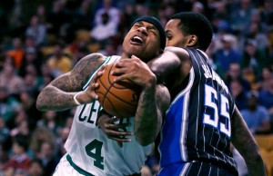 Orlando Magic guard Brandon Jennings (55) strong arms Boston Celtics guard Isaiah Thomas (4) on a drive to the basket during the second quarter of an NBA basketball game in Boston, Monday, March 21, 2016.