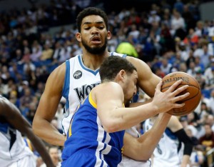 The Golden State Warriors’ Klay Thompson tries to drive around the Minnesota Timberwolves’ Karl-Anthony Towns during an NBA basketball game Monday, March 21, 2016, in Minneapolis. The Warriors won 109-104. Thompson scored 17 points, Towns 24. Jim Mone The Associated Press