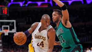 Los Angeles Lakers forward Kobe Bryant, left, drives by Boston Celtics guard Evan Turner during the first half of an NBA basketball game, Sunday, April 3, 2016, in Los Angeles. (AP Photo/Mark J. Terrill)